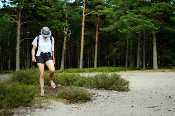 Girl walking in the forest.