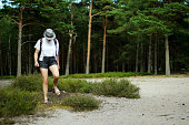 Girl walking in the forest.