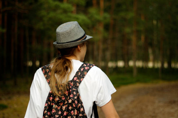 istock Girl walking in the forest. 1264907637