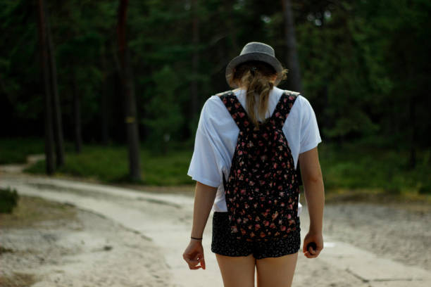 istock Girl walking in the forest. 1264907638