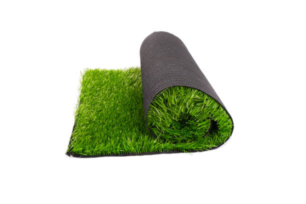 istock roll of artificial green grass on white background, coating 1264915214