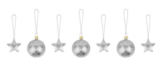 Silver Сhristmas tree decorations set white background isolated closeup, glass balls & metal stars hanging on thread collection, shiny baubles, traditional new year holiday design element, xmas toys