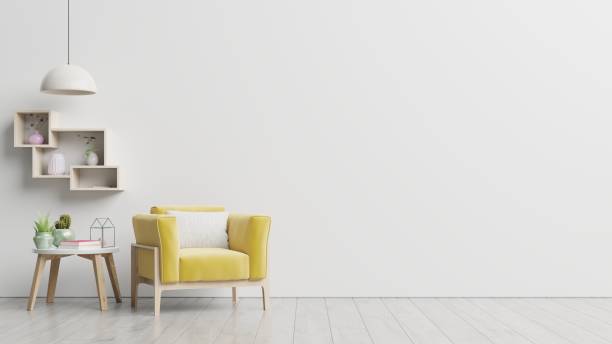 istock The interior has a yellow armchair on empty white wall background. 1264918954
