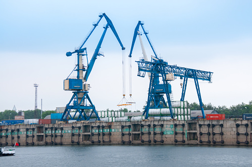 Russia, Blagoveshchensk, July 2019: River station, cranes for loading operations, Blagoveshchensk in summer