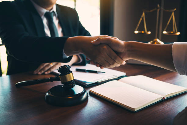 istock Lawyer is currently shaking hands with the client about the success in resolving the case. 1264923701