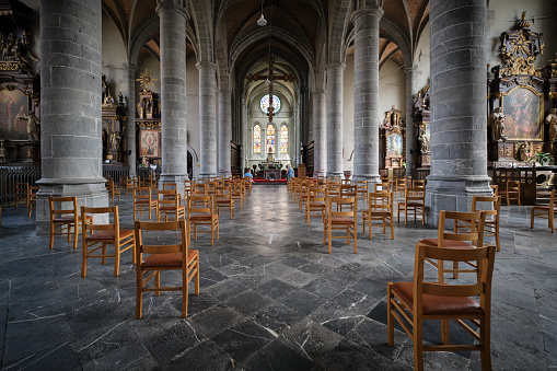 Chimay, Belgium - August 5, 2020:Cathedral interior with social distancing seats