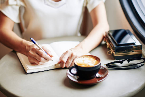 istock Woman filling gratitude journal 1264933513