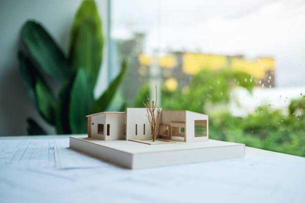 istock An architecture model with shop drawing paper on table in office 1264935006