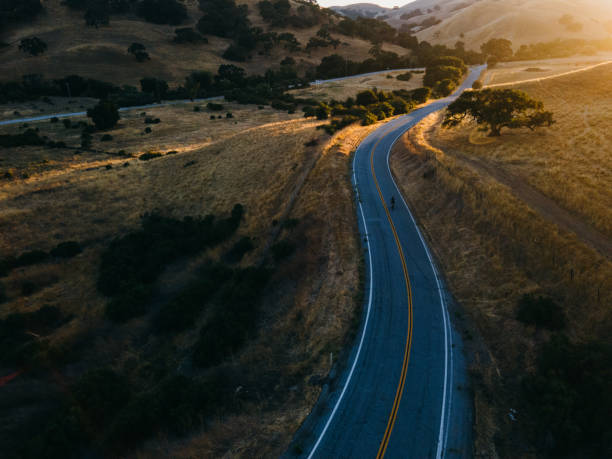 istock Solitary Cyclist on Rural Road 1264936897