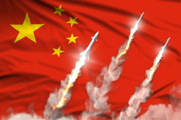istock China nuclear warhead launch - modern strategic nuclear rocket weapons concept on flag fabric background, military industrial 3D illustration with flag 1264942981