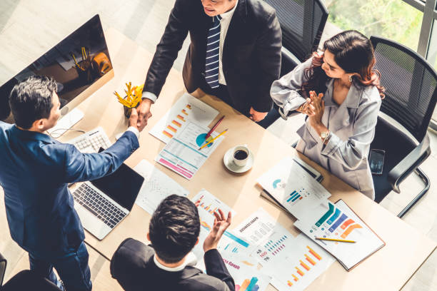 istock Group business people handshake at meeting table 1264944605