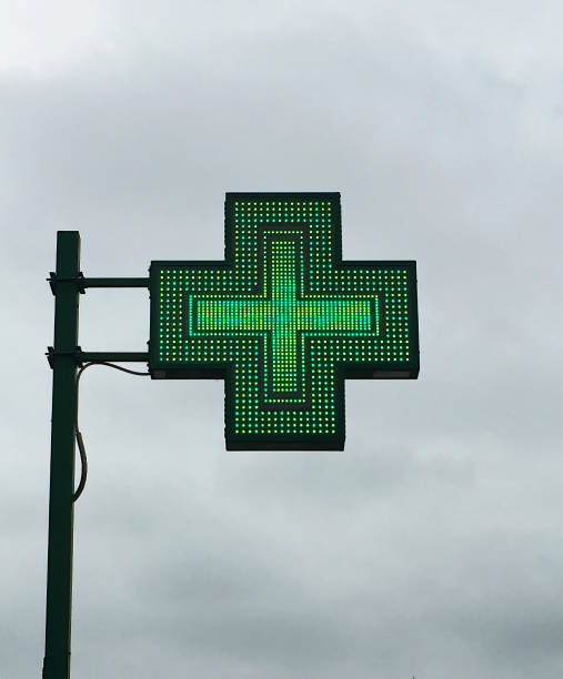 European green cross pharmacy store sign: Farmacia. Pharmacy sign. Green cross pharmacy store sign: Farmacia. Pharmacy sign. farmacia stock pictures, royalty-free photos & images