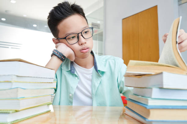 istock Tired Vietnamese schoolboy 1264944890