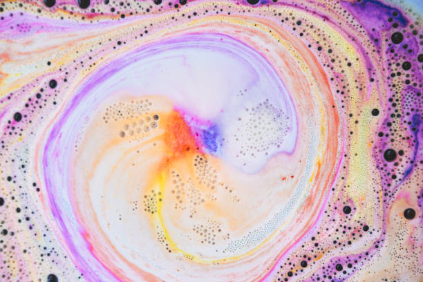 istock Colorful bath foam with rainbow and bubbles in the water. Galaxy imagination. Marble texture effect. Beauty and luxury background 1264952326