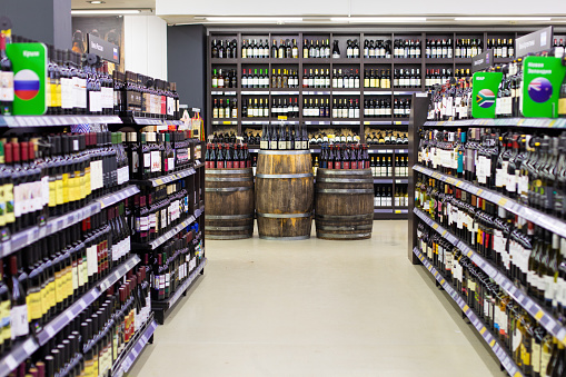 Close-up of the tops of six unopened wine bottles