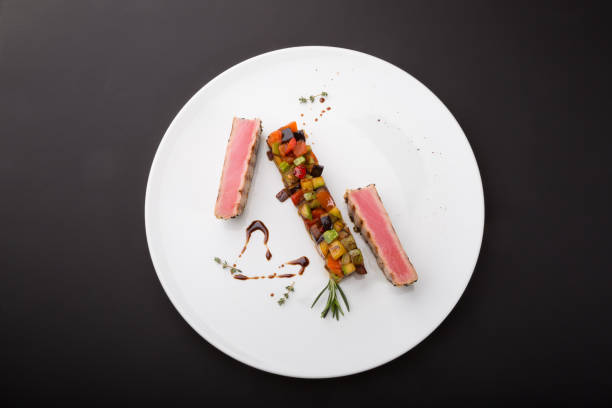 istock Prepared tuna steaks with vegetables 1264954104