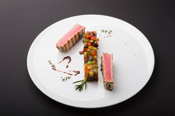 istock Prepared tuna steaks with vegetables 1264954624