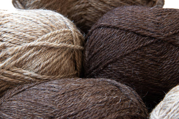 istock Wool yarns for knitting. Wool thread for knitting. Own hand. Knitting and needlework. Yarns for a scarf, sweater, and socks. Article about earning money at home with your hands. Article about knitting. Leisure for pensioners 1264954668
