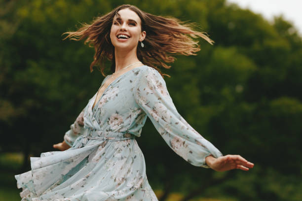 istock Pretty woman dancing outdoors 1264954851