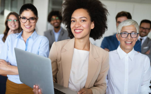 istock Successful business group of people at work in office 1264954981