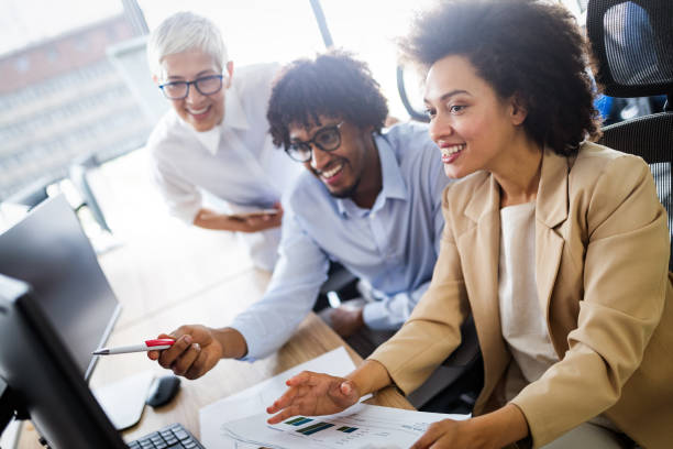 istock Successful group of business people at work in office 1264954999
