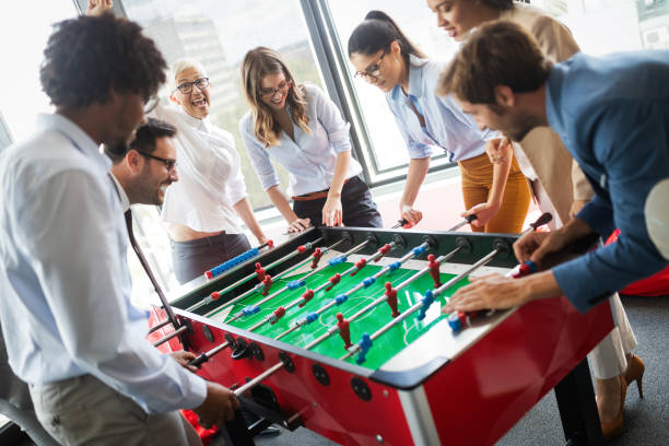 istock Multiracial people having fun in office room, excited diverse employees enjoying activity at work 1264955017