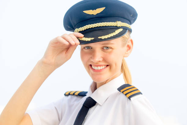 istock Happy young female aircraft pilot smiling at the camera while posing. 1264955117