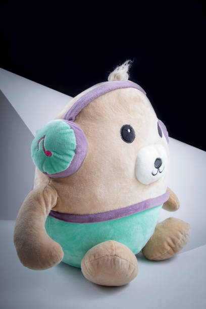 istock Children Toy : A potato doll listening to music . 1264957367