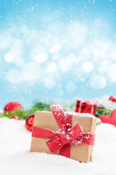 istock Christmas greeting card with decor in snow 1264961825