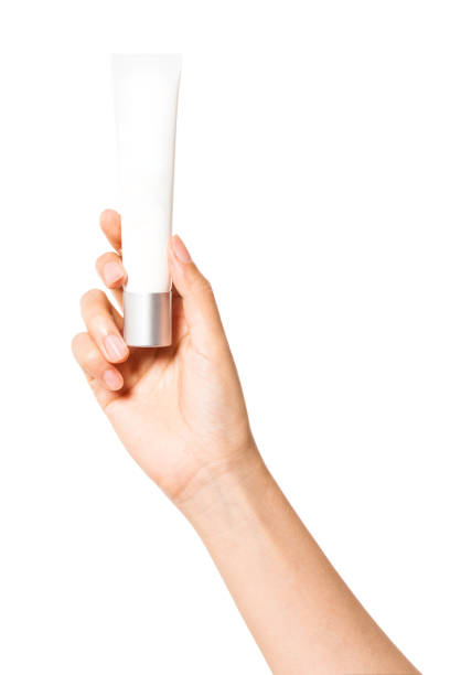 istock Woman hand hold a blank container isolated on white. 1264962165
