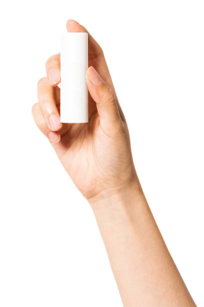 istock Woman hand hold a blank container isolated on white. 1264962166