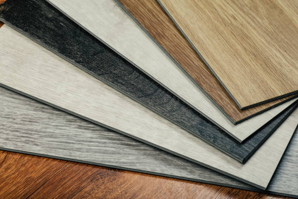 istock Laminate background. Samples of laminate or parquet with a pattern and wood texture for flooring and interior design. Production of wooden floors 1264965413