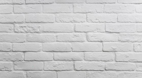 Realistic light white brick wall background.