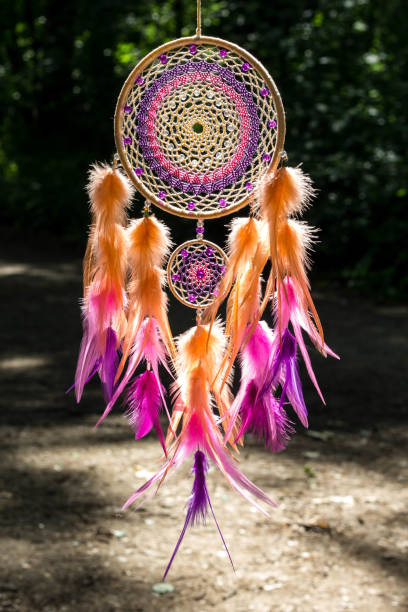 istock Handmade dream catcher with feathers threads and beads rope hanging 1264968624
