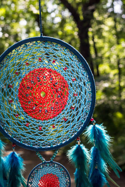 istock Handmade dream catcher with feathers threads and beads rope hanging 1264968633