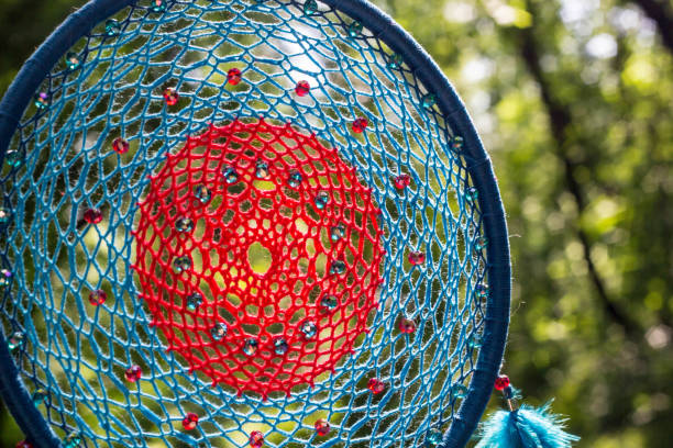 istock Handmade dream catcher with feathers threads and beads rope hanging 1264968638