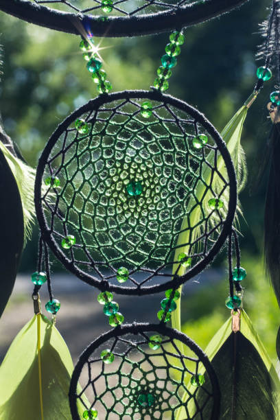 istock Handmade dream catcher with feathers threads and beads rope hanging 1264968663
