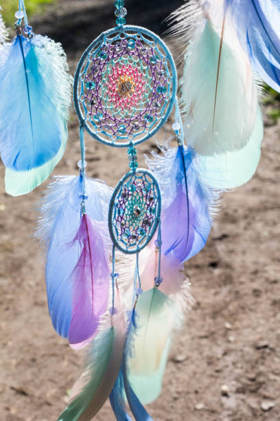 istock Handmade dream catcher with feathers threads and beads rope hanging 1264968674