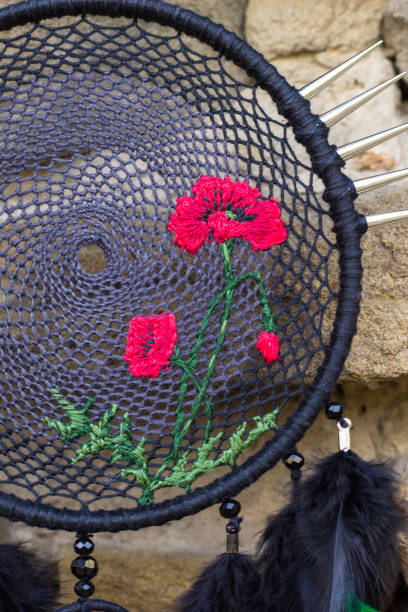istock Handmade dream catcher with feathers threads and beads rope hanging 1264968698