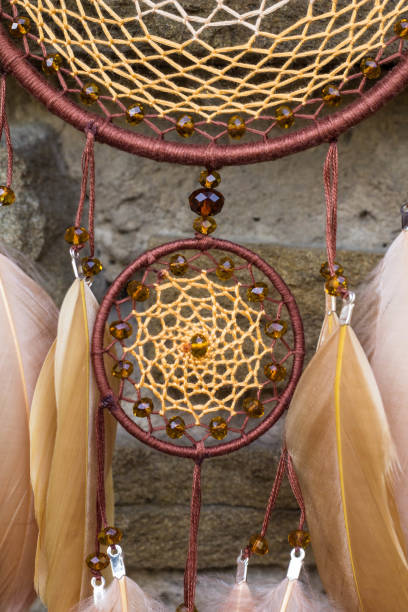 istock Handmade dream catcher with feathers threads and beads rope hanging 1264968730