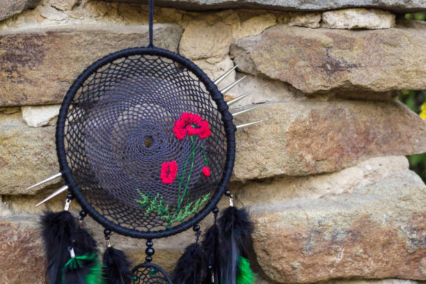 istock Handmade dream catcher with feathers threads and beads rope hanging 1264968752