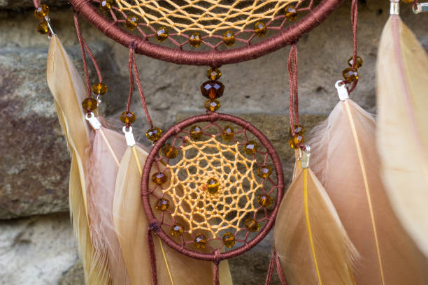istock Handmade dream catcher with feathers threads and beads rope hanging 1264968763
