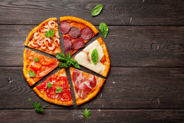 istock Tasty slices of different pizza 1264968799