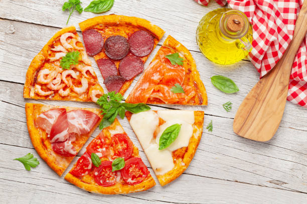 istock Tasty slices of different pizza 1264968825