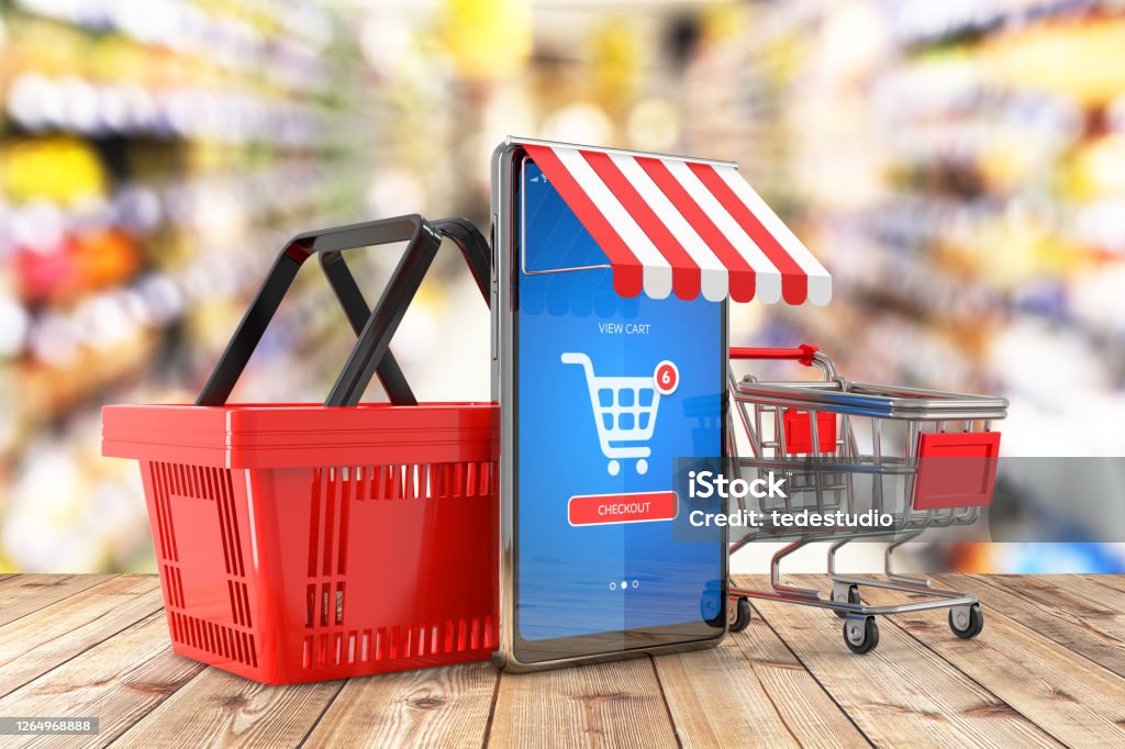 Shopping basket and shopping trolley cart. Cell phone with mobile e-shop application on screen as a online shopping symbol and supermarket interior in background - 3d illustration Market - Retail Space Stock Photo