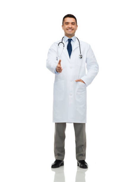 istock smiling doctor in white coat making handshake 1264969997