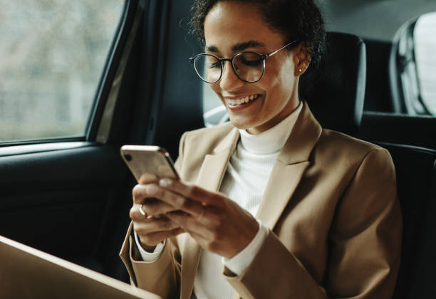 smiling woman traveling by a car - car equipment smiling working imagens e fotografias de stock