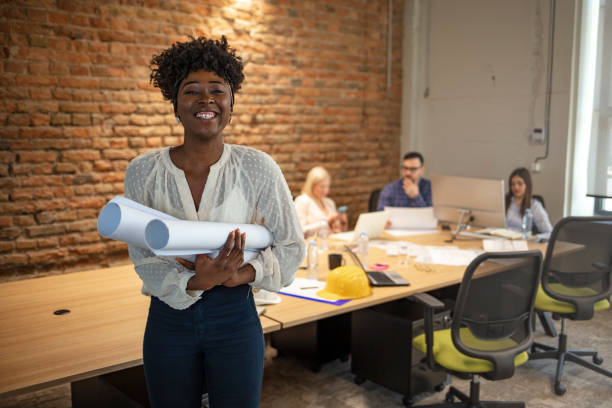 istock Young businesswoman standing in office. 1264971955