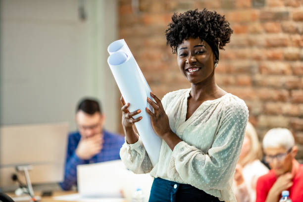 istock Young businesswoman standing in office. 1264972948