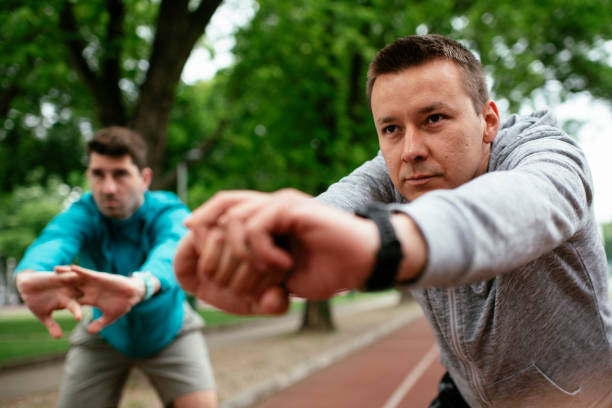 istock Young men exercising on a race track. 1264979732